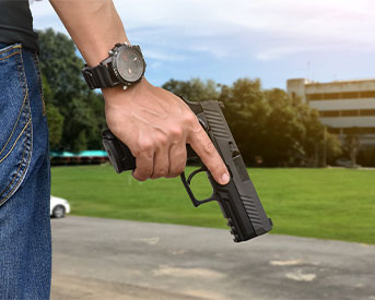 pistol holding in right hand of shooter